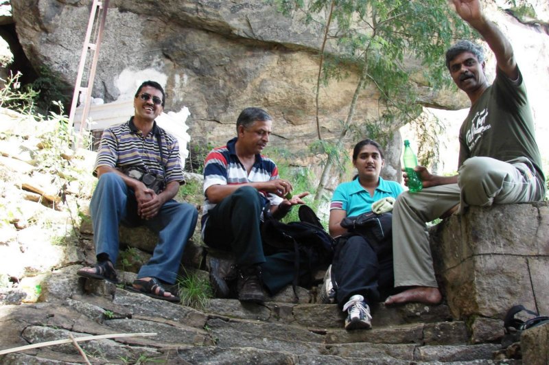 sittingonthestepsunderthearchwithasmalltempleseeninthebackoframeshsir.jpg